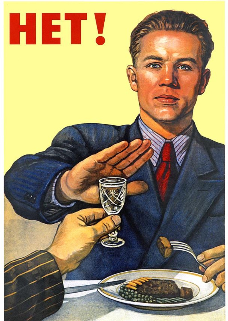 A soviet man holding his hand, denying a shot glass of liquor. Text to the top left says HET! (No!)