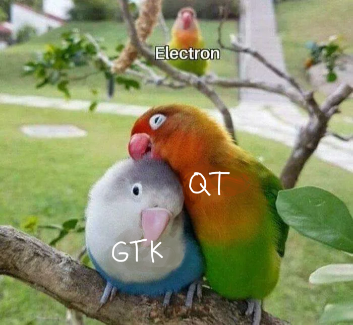 three birds, GTK and QT getting along, with "Electron" in the background menacingly watching